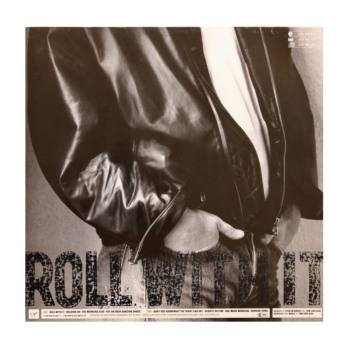 Steve Winwood - Roll With It